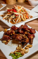 Fried Pork Ribs with Green papaya salad (Som Tum)