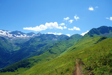 Fototapeta na wymiar Hiking trail GR10 called Pyrenees Traverse leading to the d'Espingo lake deep in the mountains