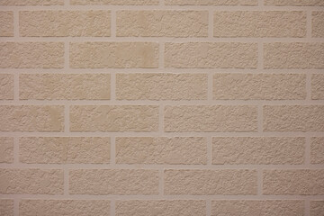 Light brown brick wall high resolution photo.