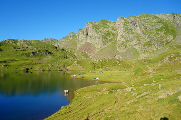 Midi d'Ossau Peak and Gentau lake on a hiking trail GR10, Pyrenees, France