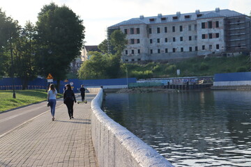young girls walking near city quayside in europe