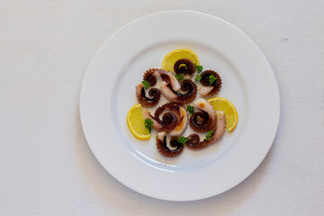 Grilled octopus with lemon and parsley