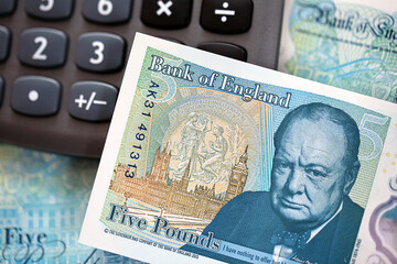 British Currency. The new UK polymer five pound note with a calculator. 