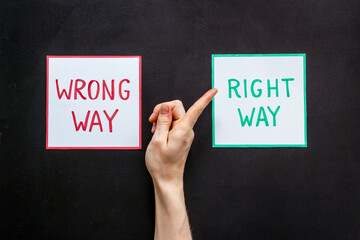 Choice concept. Right and wrong way icons, female hands choose top view
