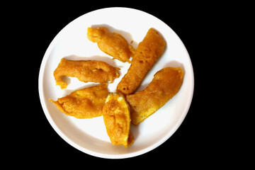 South Indian Potato Snack, Vazhakkai Bajji served on black background