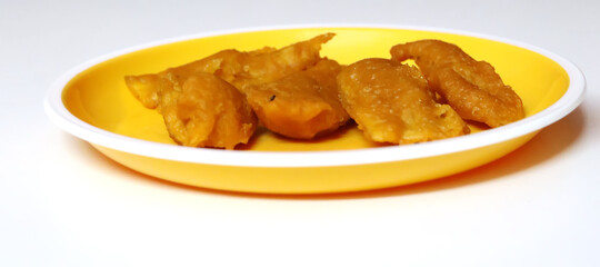 Indian food raw banana bajji or fritter, which is a traditional and popular dish.