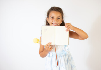 Fototapeta premium Beautiful girl in blue dress smiling on white background