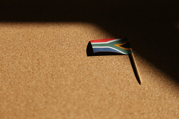 A South African flag and a black shadow. 