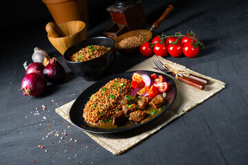 Buckwheat groats baked in the oven with beef goulash