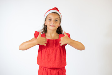 Beautiful girl in red dress with Christmas hat smiling