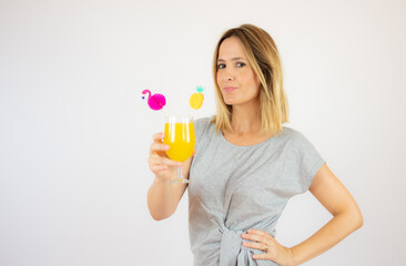 Beautiful woman in grey dress with a cocktail