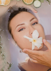 Beautiful young woman with clean fresh skin in a bathroom close-up.Cosmetology, beauty and spa.