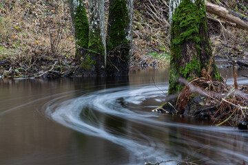 A small rocky river in spring taken in Latvia with long exposure