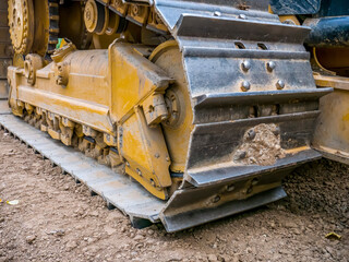 Fototapeta na wymiar Close up detail with chain tracks of a bulldozer