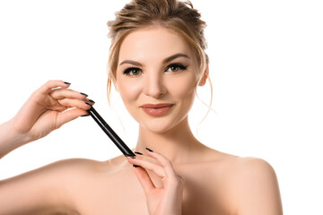 Fototapeta premium smiling naked beautiful blonde woman with makeup and black nails holding mascara isolated on white