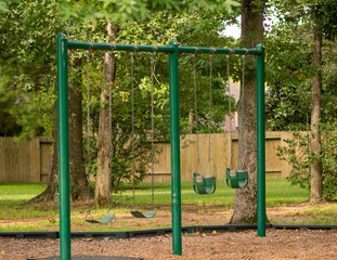 A swing set at a neighborhood pocket park in Conroe, TX.