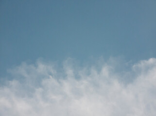 soft white clouds on blue sky background.