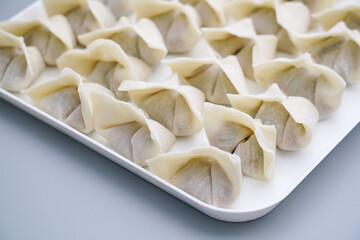 Traditional Chinese food wonton is placed on a white plate. The delicious wonton is on a plate.