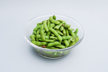 A traditional Chinese delicacy in solid color, boiled soybeans in brine. Chinese traditional food boiled soybean.