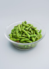 A traditional Chinese delicacy in solid color, boiled soybeans in brine. Chinese traditional food boiled soybean.