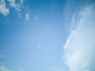 soft white clouds on blue sky background.