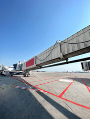 Taken a picture on apron under the passenger boarding bridge. Sunny day in Antalya Airport