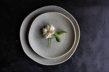 Minimalistic table setting with white rose