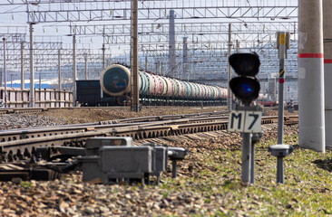 Rails, sleepers and trains with tanks at the railway freight station in Vladivostok, Russia.