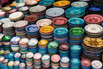 colorful ceramic plates in a street market