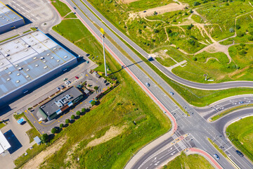 Aerial top view of the large logistics park with warehouse, loading hub with many semi-trailers trucks.