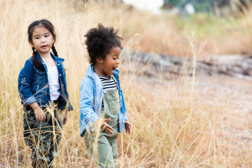Children hiking in mountains or forest. Kids Camping summer. Two funny little girls having fun...