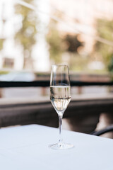 Glasses of white wine against sunset, a cafe