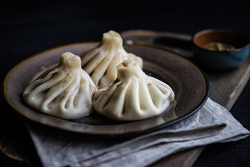 Traditional georgian khinkali dish on stone background