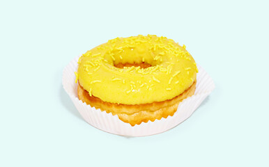 Sweet glazed yellow doughnut isolated on colorful background