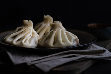 Traditional georgian khinkali dish on stone background