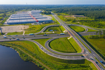 Huge shopping mall of household goods with a lot of parking space, aerial view