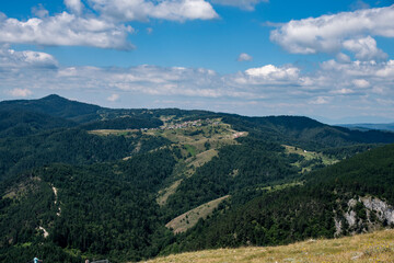Fototapeta na wymiar Green mountains in Bulgaria and blue sky with white clouds