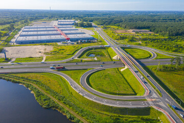 Huge shopping mall of household goods with a lot of parking space, aerial view