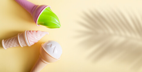 Abstract ice cream on a yellow background with a shadow from a palm tree. Summer pop art concept