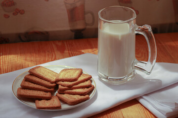White milk cup with delicious coconut biscuit for breakfast