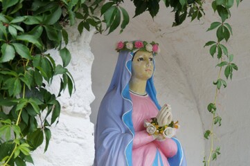 A roadside chapel with a statue of the Virgin Mary in the village of Poland