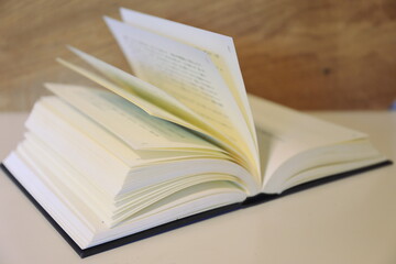 Close-up of books open on the library desk selective focus and shallow depth of field