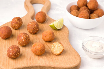 Vegetarian dish of chickpea falafel on wooden board