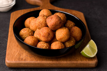 Vegetarian middle eastern dish of chickpea falafel on black background