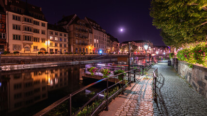 Fototapeta na wymiar Alsatian architecture Reflection at night in Strasbourg in France