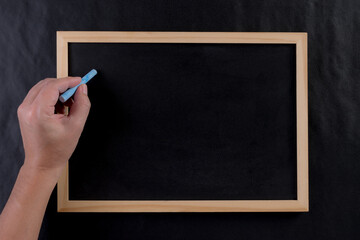 Man writing by left hand. Left hander day concept. Copy space for text.