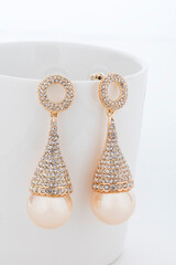 Close up of diamond earrings. space for your text.