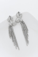 Close up of diamond earrings. space for your text.