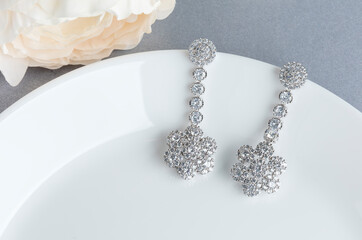 Close up of diamond earrings. space for your text.