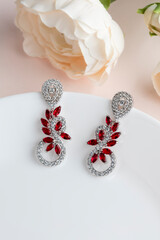 Close up of diamond earrings. space for your text.